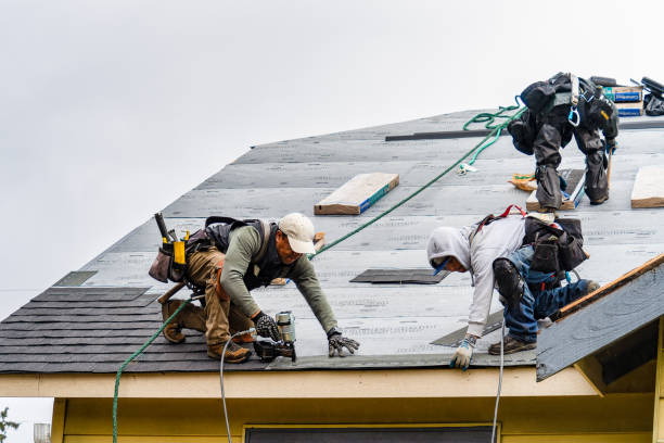 Professional Gutter Installation technician working in Bellows Falls, VT